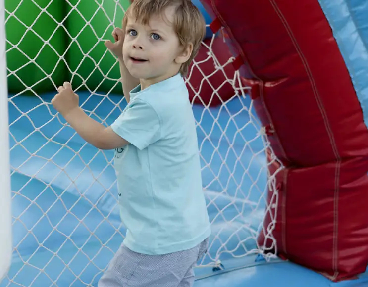 White elastic fall protection net for playgrounds or trampolines